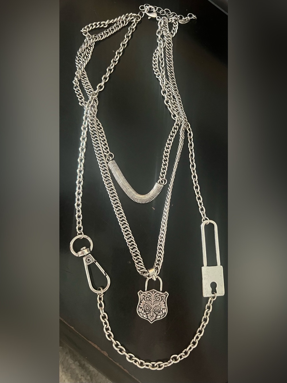 Silver Multi-Chain Necklace with Ornate Shield and Key Charms